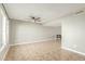 Large open living area with tile flooring, neutral color palette, and natural light at 6411 S El Camino Dr, Tempe, AZ 85283