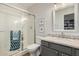 Well-lit bathroom showcasing a glass shower, a toilet, and a vanity with a marble countertop at 6916 E Trailridge Cir, Mesa, AZ 85207