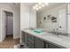 Stylish bathroom features double vanity with granite countertop and modern fixtures at 6916 E Trailridge Cir, Mesa, AZ 85207