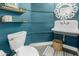 Stylish powder room with blue walls, unique mirror, and modern toilet, creating a welcoming space at 6916 E Trailridge Cir, Mesa, AZ 85207