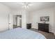 Serene bedroom with neutral tones and a comfortable bed and dresser at 6916 E Trailridge Cir, Mesa, AZ 85207