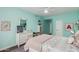 Bright bedroom with unique turquoise walls, white furniture and decorative accents at 6916 E Trailridge Cir, Mesa, AZ 85207