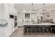 Modern kitchen featuring stainless steel appliances, large island with seating, and stylish pendant lights at 6916 E Trailridge Cir, Mesa, AZ 85207