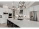 Bright kitchen features a large island, stainless steel appliances, and stylish light fixtures at 6916 E Trailridge Cir, Mesa, AZ 85207