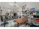 Multi-purpose room featuring bikes, a large table and ample storage to support your hobbies at 6916 E Trailridge Cir, Mesa, AZ 85207