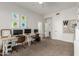 Spacious living room featuring desks for work and unique wall decorations to personalize the space at 6916 E Trailridge Cir, Mesa, AZ 85207