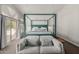 Beautiful primary bedroom with a four-poster bed and comfortable seating area at 6916 E Trailridge Cir, Mesa, AZ 85207