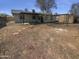 Large backyard with minimal landscaping, offering potential for customization at 7334 W Comet Ave, Peoria, AZ 85345