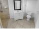 Well-lit bathroom featuring a modern vanity, toilet, shower and neutral tile flooring at 7334 W Comet Ave, Peoria, AZ 85345