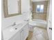Clean bathroom featuring a vanity, toilet, and tiled shower-tub combination at 7334 W Comet Ave, Peoria, AZ 85345
