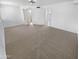 Large bedroom featuring neutral carpet and multiple doorways leading to other rooms at 7334 W Comet Ave, Peoria, AZ 85345