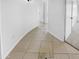 Hallway with tile flooring providing seamless transition between rooms in the home at 7334 W Comet Ave, Peoria, AZ 85345