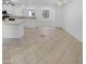 Open kitchen with tile flooring, island, and white cabinetry offers a functional and stylish space at 7334 W Comet Ave, Peoria, AZ 85345