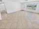 Inviting living room with tile flooring and natural light, creating a warm and welcoming space at 7334 W Comet Ave, Peoria, AZ 85345