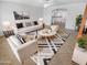 Bright living room featuring modern decor, stylish furniture, and a decorative rug at 7334 W Comet Ave, Peoria, AZ 85345