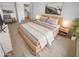 Comfortable main bedroom showcasing a wooden bed frame and tasteful decor at 7334 W Comet Ave, Peoria, AZ 85345