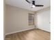 Cozy bedroom with ceiling fan, window with blinds, and closet at 7839 E Osage Ave, Mesa, AZ 85212