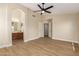 Bright main bedroom boasts lots of space, natural light, and adjoins ensuite bathroom at 7839 E Osage Ave, Mesa, AZ 85212