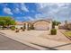 Inviting single-story home with a well-maintained front yard and attached garage at 7839 E Osage Ave, Mesa, AZ 85212