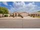 Charming single-story home with well-maintained landscaping, lush green shrubs, and an attached two-car garage at 7839 E Osage Ave, Mesa, AZ 85212