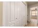 Hallway with access to bedroom with wood floors and large closet at 7839 E Osage Ave, Mesa, AZ 85212