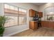Well-lit kitchen featuring wood cabinets, stainless steel appliances, and a window at 7839 E Osage Ave, Mesa, AZ 85212