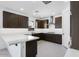 Modern kitchen featuring stainless steel appliances, dark wood cabinets and elegant counter tops at 8240 E Quintuplet Ave, Mesa, AZ 85212