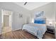 Cozy bedroom with laminate wood flooring and stylish furnishings at 8245 E Bell Rd # 133, Scottsdale, AZ 85260
