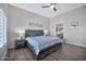 Bright bedroom with a view of the ensuite bathroom featuring a comfortable bed and soft lighting at 8245 E Bell Rd # 133, Scottsdale, AZ 85260