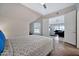 Relaxing bedroom that overlooks a living room through a set of folding doors at 8245 E Bell Rd # 133, Scottsdale, AZ 85260