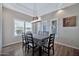 Inviting dining room with modern lighting, plantation shutters and seating for six at 8245 E Bell Rd # 133, Scottsdale, AZ 85260