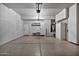 Well-organized garage with storage cabinets and good lighting at 8245 E Bell Rd # 133, Scottsdale, AZ 85260