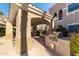 Outdoor grill area with a built-in grill, seating, and convenient access for residents at 8245 E Bell Rd # 133, Scottsdale, AZ 85260