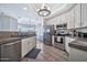 Modern kitchen boasting stainless steel appliances, white cabinetry, and tile flooring at 8245 E Bell Rd # 133, Scottsdale, AZ 85260