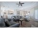 Comfortable living room featuring a ceiling fan and seamless open-concept design to the kitchen at 8245 E Bell Rd # 133, Scottsdale, AZ 85260