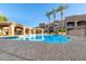 Serene community pool with shaded seating areas, beautiful architecture, and resort-style amenities at 8245 E Bell Rd # 133, Scottsdale, AZ 85260