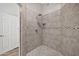 Tiled shower stall with modern fixtures, including a rainfall showerhead at 8245 E Bell Rd # 133, Scottsdale, AZ 85260
