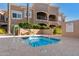 Relaxing spa area with a bubbling hot tub, lush greenery, and comfortable seating at 8245 E Bell Rd # 133, Scottsdale, AZ 85260
