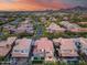 Captivating aerial shot showcasing home, yard, and nearby pool nestled among lush greenery at 9439 E Trailside Vw, Scottsdale, AZ 85255