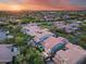 Aerial view showcasing home, green backyard, patio area, and mature surrounding landscape at 9439 E Trailside Vw, Scottsdale, AZ 85255