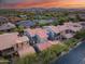 Gorgeous aerial view of the neighborhood highlighting the home's roof and lush landscaping at 9439 E Trailside Vw, Scottsdale, AZ 85255
