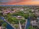 Gorgeous aerial view of a Primary-planned community featuring a common green area, landscaping and beautiful homes at 9439 E Trailside Vw, Scottsdale, AZ 85255