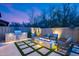 Outdoor area with a built-in barbecue, fire pit, and comfortable seating at 9439 E Trailside Vw, Scottsdale, AZ 85255