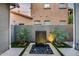 Backyard features a modern fountain, lush plants, and a peaceful ambiance at 9439 E Trailside Vw, Scottsdale, AZ 85255