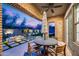 Inviting backyard featuring a covered patio, a fire pit, and lush landscaping at 9439 E Trailside Vw, Scottsdale, AZ 85255