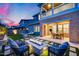 Inviting backyard with a fire pit, outdoor seating, and a well-maintained lawn perfect for entertaining at 9439 E Trailside Vw, Scottsdale, AZ 85255