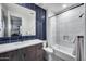 Bathroom featuring marble vanity, blue tiled wall, and shower-tub combination with modern finishes at 9439 E Trailside Vw, Scottsdale, AZ 85255