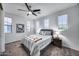 Bedroom with a ceiling fan, neutral walls, carpet, a queen-sized bed, and three windows at 9439 E Trailside Vw, Scottsdale, AZ 85255