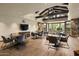 Bright clubhouse with comfortable seating, large windows, and a stylish stone accent wall at 9439 E Trailside Vw, Scottsdale, AZ 85255