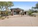 Welcoming clubhouse entrance with decorative wreaths and landscaped planters at 9439 E Trailside Vw, Scottsdale, AZ 85255